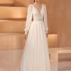 Boho & Vintage Brautkleid mit gehäkelter Spitze, langen Ärmeln und fließendem Chiffonrock in A-Linie